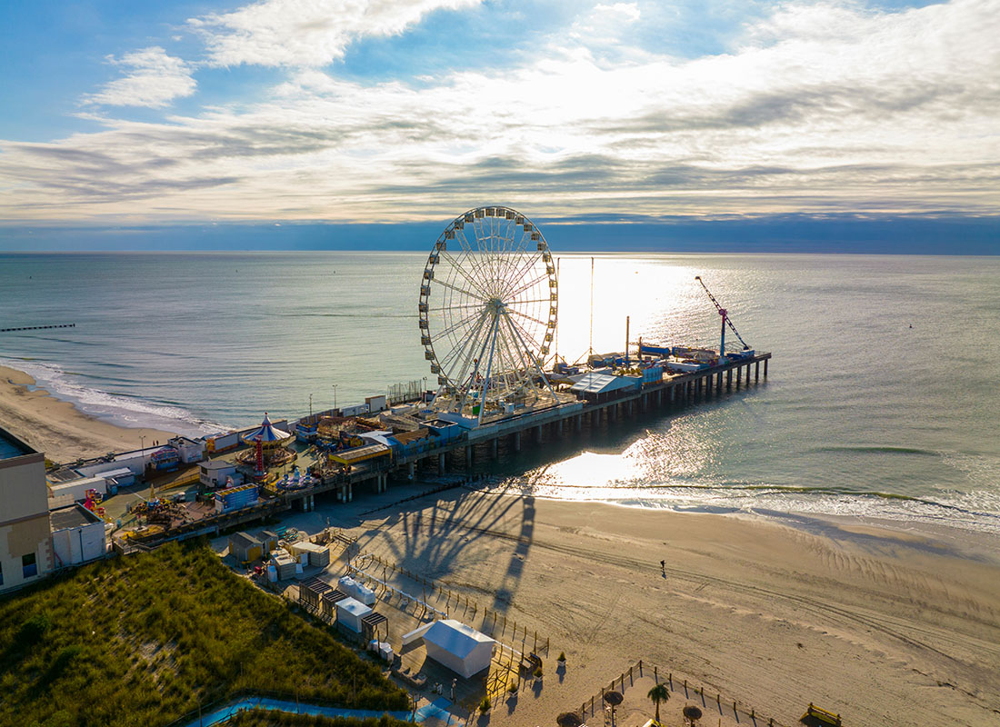 Atlantic City, NJ - View of Beach and Ferris Wheel in Atlantic City New Jersey at Sunset